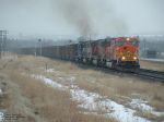 BNSF 8240 hauling coal drag up grade on snowy day
